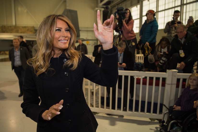 First Lady Melania Trump waves to children at Joint Base Langley-Eustis, Virginia, Dec. 12, 2018.