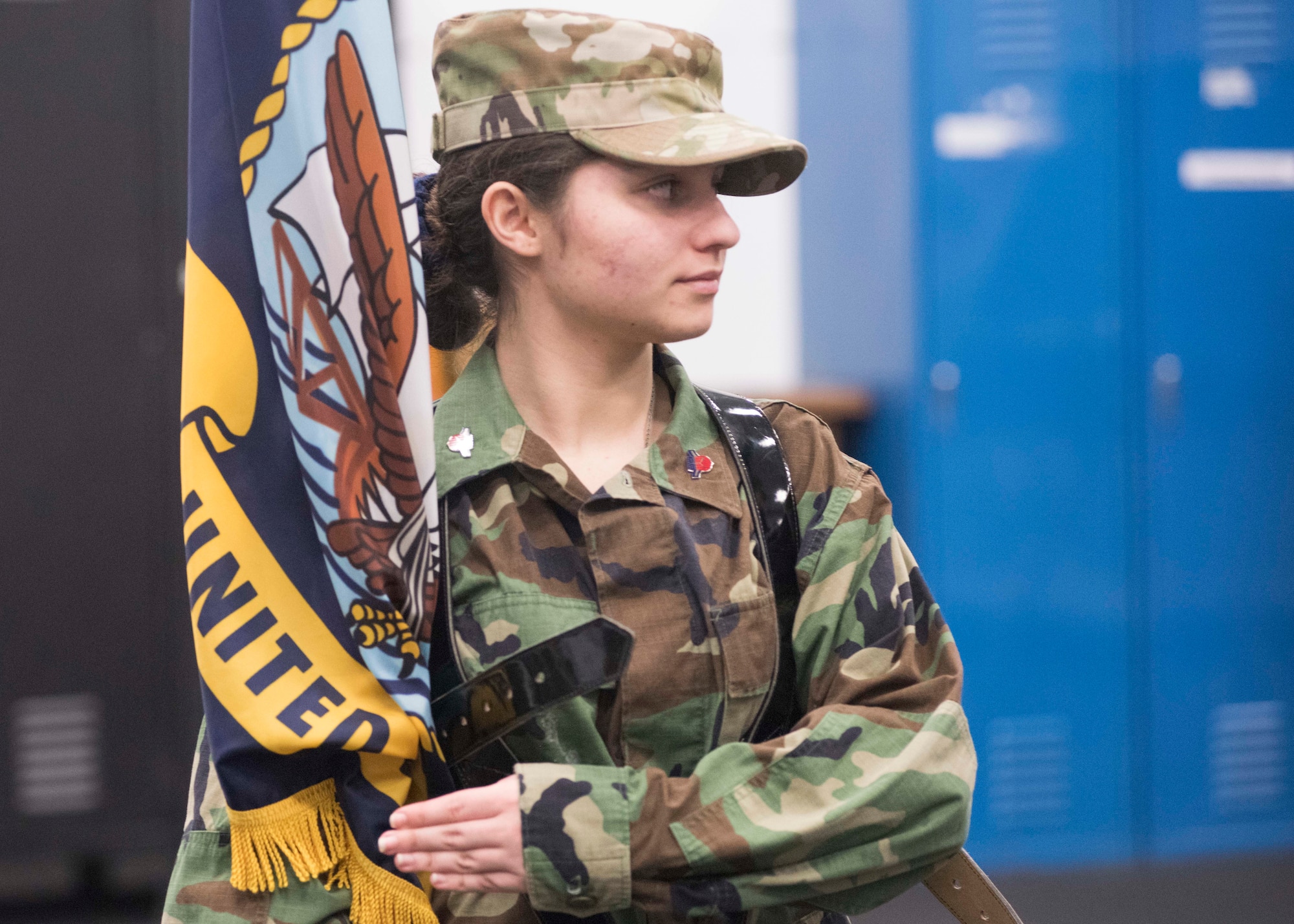 Sherry Horner, Civil Air Patrol Spokane Composite Squadron cadet, holds a ceremonial flag while practicing "presenting colors" with Honor Guardsmen at Fairchild Air Force Base, Washington, Nov. 26, 2018. CAP cadets are volunteers from ages 12-20 that dedicate their time performing duties similar to the National Guard during after-school and summer camp-style programs. (U.S. Air Force photo/ Senior Airman Ryan Lackey)