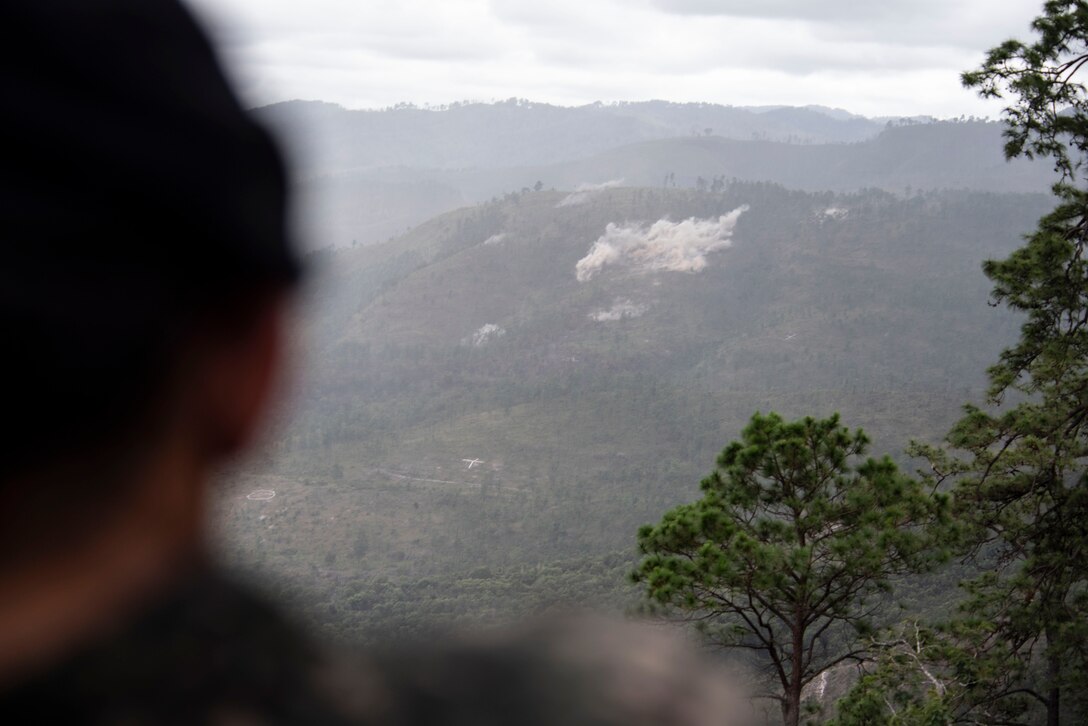 A Honduran soldier watches a demonstration during Artillery Day at Zambrano, Dec. 4, 2018.