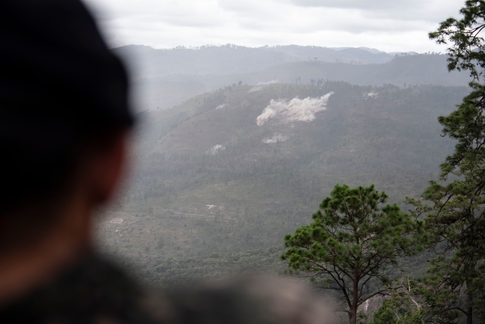 A Honduran soldier watches a demonstration during Artillery Day at Zambrano, Dec. 4, 2018.