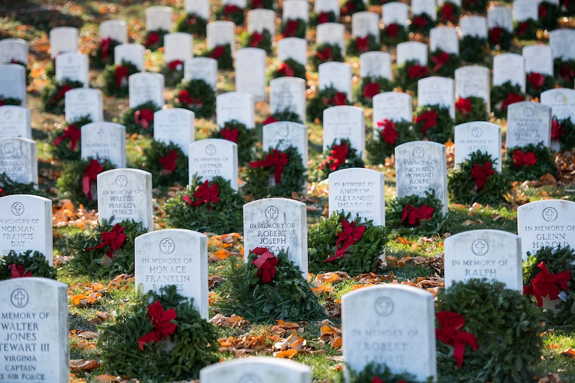 Wreaths on graves at Arlington National Cemetery.