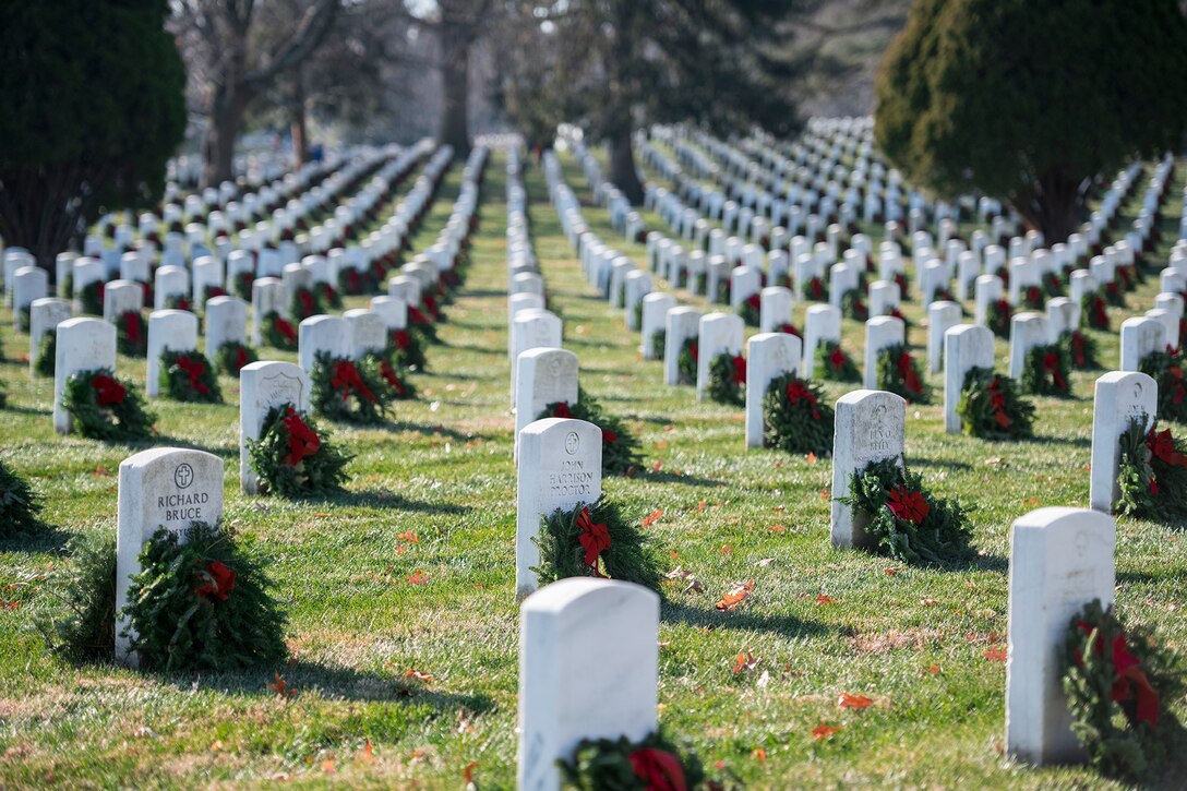 Wreaths on graves at Arlington National Cemetery.