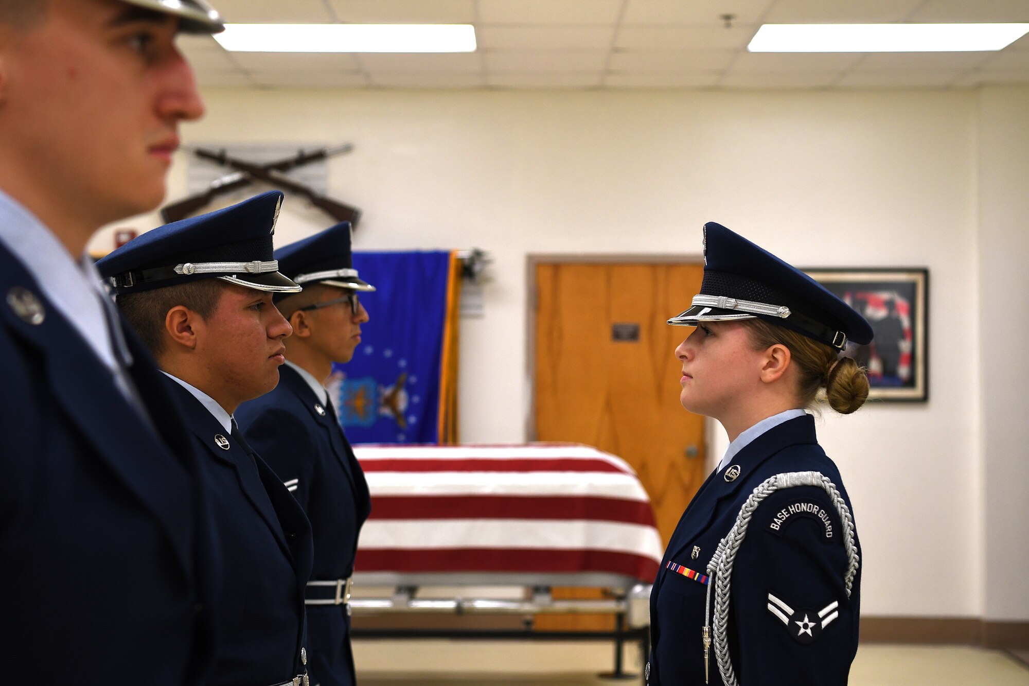 U.S. Air Force Airman 1st Class Brandy Michaud, Keesler Air Force Base Honor Guard member, inspects Airmen during an open ranks inspection inside the honor guard building at Keesler Air Force Base, Mississippi, Nov. 29, 2018. Honor guard members practice four out of five working days to execute precise movements for future details. (U.S. Air Force photo by Airman 1st Class Suzie Plotnikov)