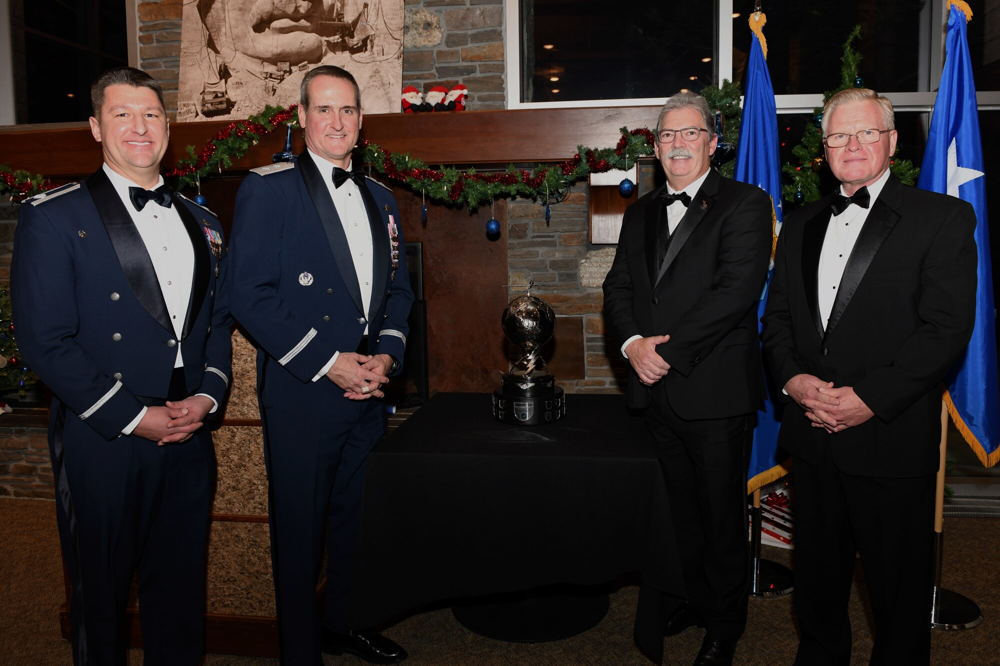 Lt. Col. Michael, Maj. Gen. Peter Gersten, David Alexander, and Larry Stutzriem stand together during the General Atomics’ MQ-1B/9 Squadron of the Year awards presentation at Mount Rushmore in Keystone, S.D., Dec. 7, 2018. The 89th Attack Squadron, a tenant unit at Ellsworth Air Force Base, won this year’s award. Michael is the 89th ATKS commander; Gersten is the U.S. Air Force Warfare Center commander; Alexander is the General Atomics Aeronautical Systems Inc. aircraft systems business unit president; and Stutzriem is the Mitchell Institute for Aerospace studies director of research. (U.S. Air Force photo by Senior Airman Denise Jenson)