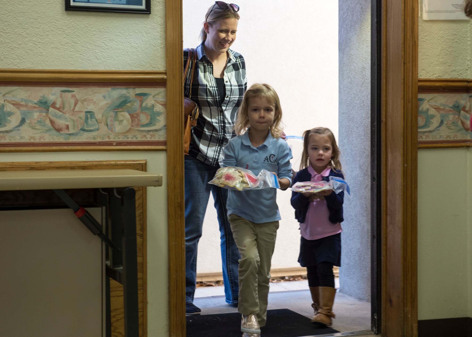 Children of members of the 97th Training Squadron bring cookies to the Altus Air Force Base Chapel, Dec. 10, 2018, at Altus AFB, Okla.