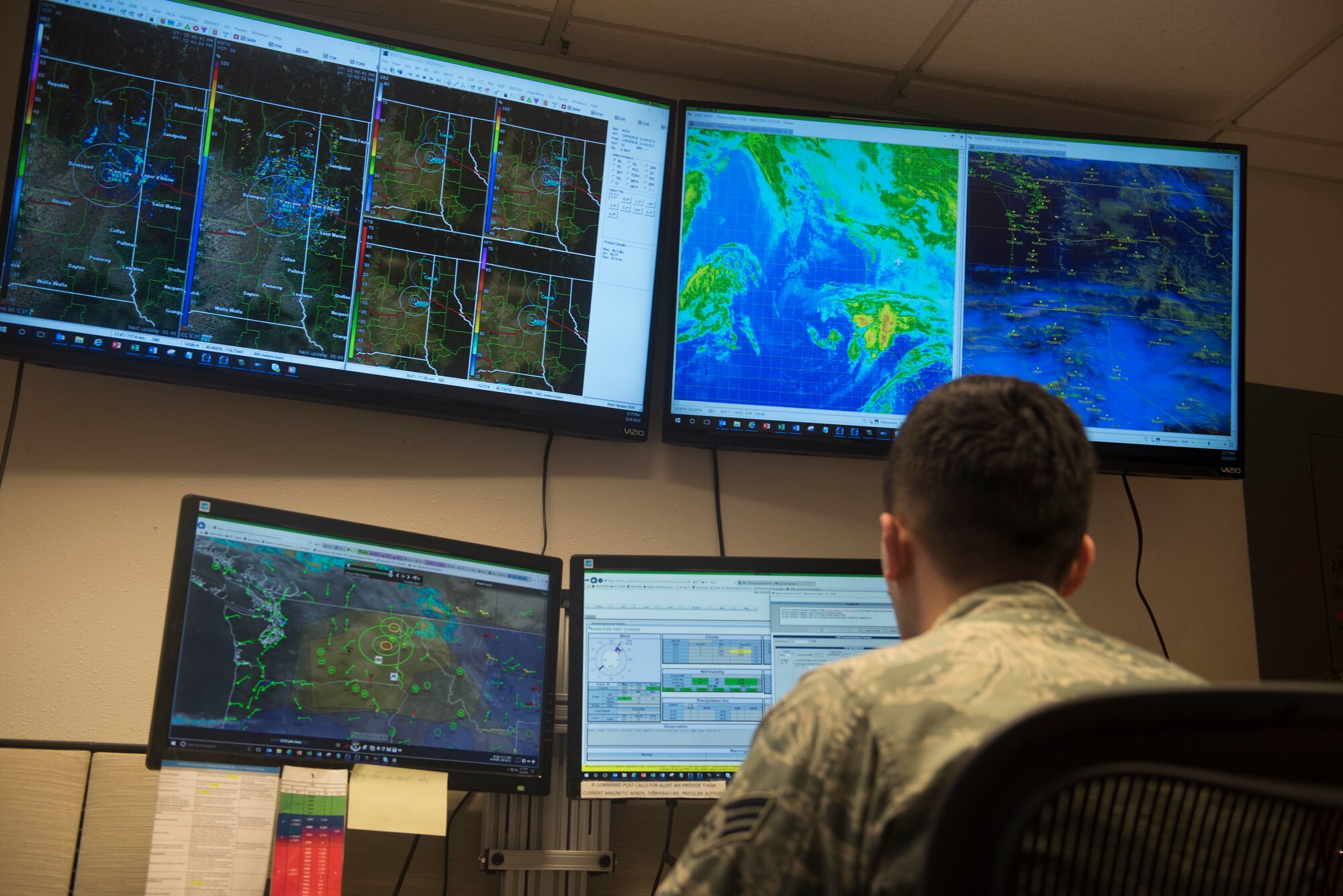 Senior Airman Christopher McGrath, 92nd Operation Support Squadron weather flight forecaster journeyman, monitors weather patterns and systems Dec. 4, 2018, at Fairchild Air Force Base, Washington. Daily operations of a weather Airman include performing daily mission execution forecasts and terminal aerodrome forecasts, which are forecasts within five nautical miles of Fairchild. These forecasts become translated into a five-day forecast used for general mission planning on base. (U.S. Air Force photo/Airman 1st Class Lawrence Sena)