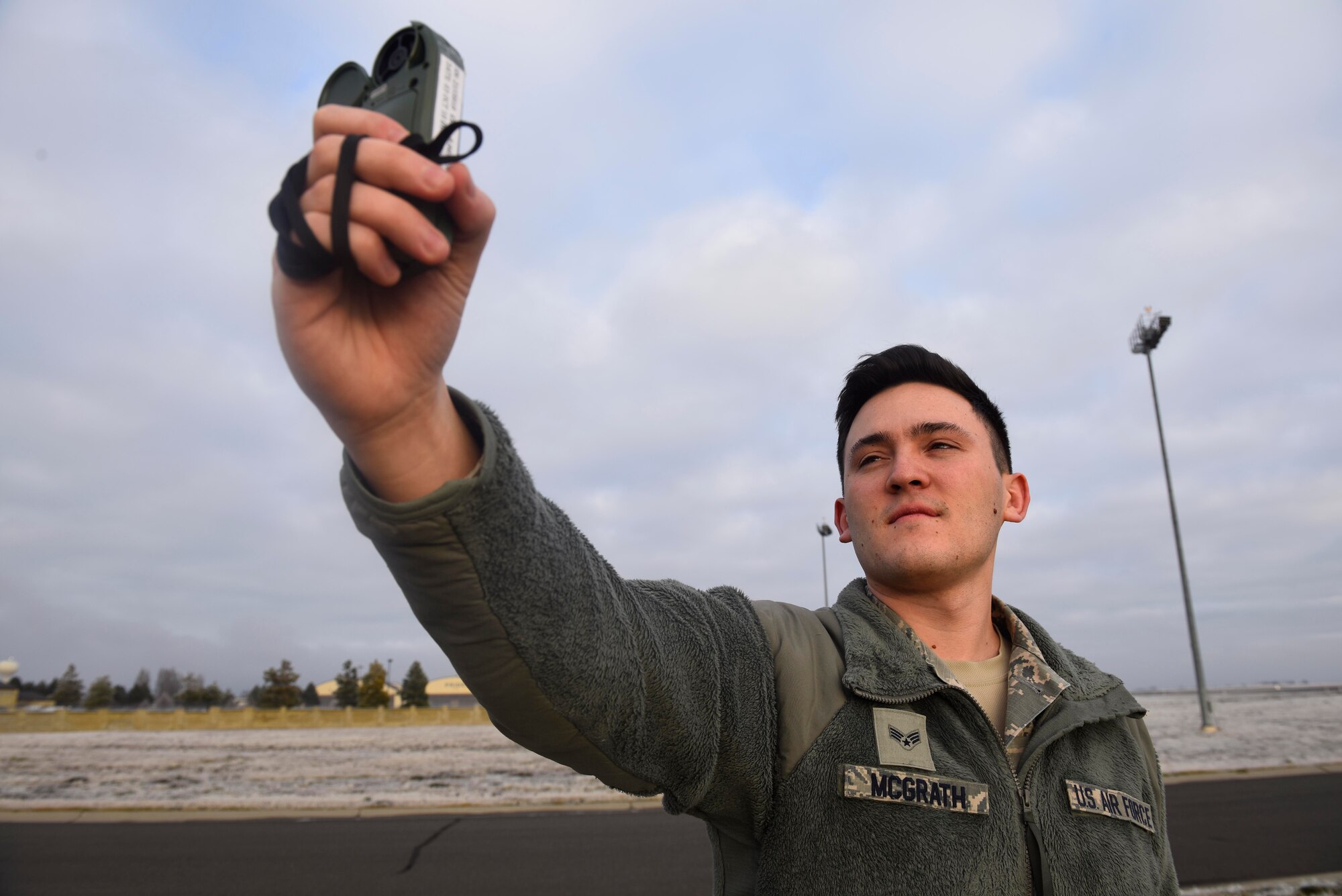 Senior Airman Christopher McGrath, 92nd Operation Support Squadron weather flight forecaster journeyman, uses a Kestrel Weather Meter Dec. 4, 2018, at Fairchild Air Force Base, Washington. A Kestrel Weather Meter is a handheld wind and weather meter that provides the speed of the wind, the temperature, humidity and heat stress information. (U.S. Air Force photo/Airman 1st Class Lawrence Sena)