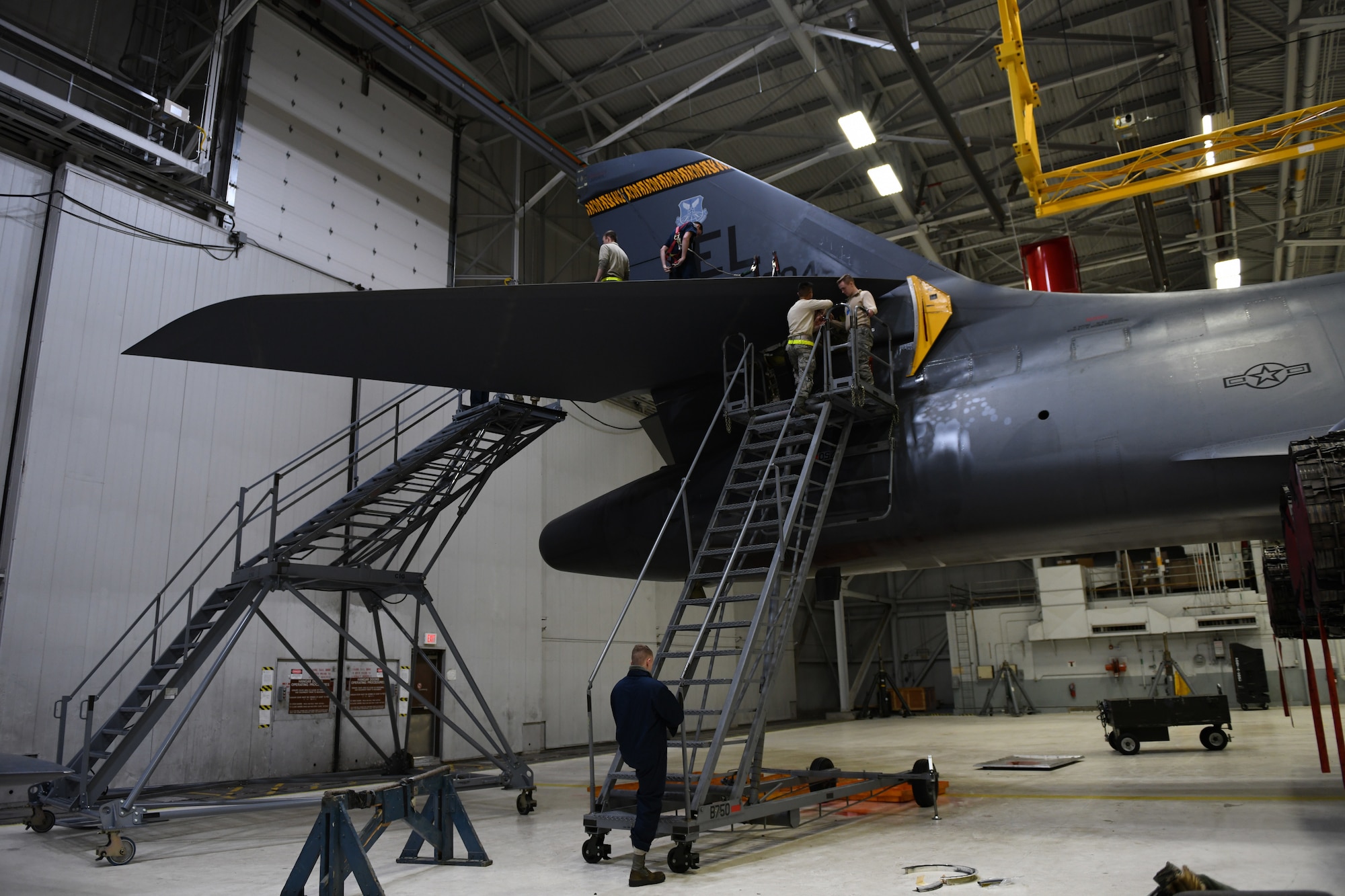 Airmen from the 28th Aircraft Maintenance Squadron’s aircraft hydraulic system shop work on a B-1B Lancer inside a hangar at Ellsworth Air Force Base, S.D., Dec. 4, 2018. These Airmen are responsible for ensuring the hydraulic and pneumatic systems are in working order, and they maintain and repair items like the landing gear, brakes and flight controls. (U.S. Air Force photo by Senior Airman Denise Jenson)