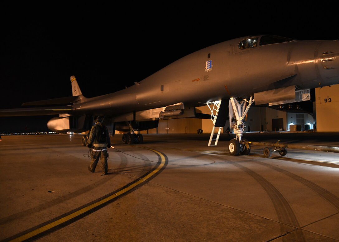 Staff Sgt. Joseph Funk, a crew chief assigned to the 28th Aircraft Maintenance Squadron, taxies an aircraft into a spot on the flight line at Ellsworth Air Force Base, S.D., Dec. 4, 2018. Crew chiefs are responsible for the B1-B Lancers’ day-to-day maintenance including post flight and preflight inspections. (U.S. Air Force photo by Senior Airman Denise Jenson)