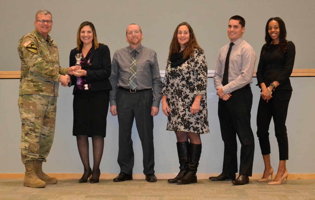 Defense Logistics Agency Troop Support commander Army Brig. Gen. Mark Simerly presents the DLA Troop Support Innovation Award to the Subsistence supply chain’s drone support team during a town hall in Philadelphia, Nov.11, 2018. The team examined the use of unmanned air systems aka "drones,” to deliver food and water to areas not accessible by normal modes of transportation.