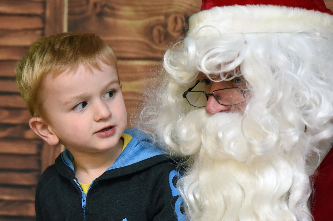 A child visits with Santa.