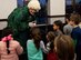 Mrs. Claus greets a group of children at the Holiday Party and Tree Lighting Ceremony, Dec. 7, 2018, at Scott Air Force Base, Illinois. The event also included craft stations, a youth holiday concert, treats, and photos with Santa and Mrs. Claus.
