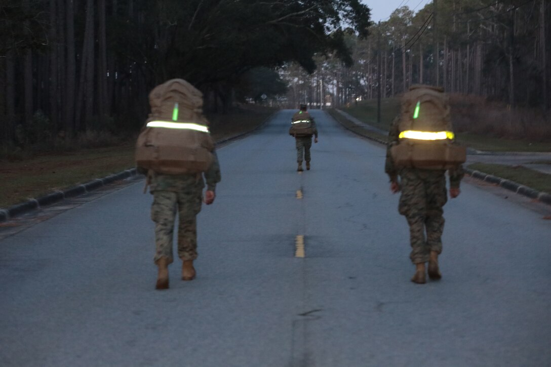 Marines with Marine Corps Logistics Base Albany commemorated the 77th anniversary of the attack of Pearl Harbor with a 3-mile Warrior Hike aboard the installation, Dec. 7. The attack was a surprise military strike by the Imperial Japanese Navy Air Service against the United States naval base at Pearl Harbor, Hawaii Territory, on the morning of Dec. 7, 1941. More than 50 Marines took the hike to remember the lessons learned from the attack and why it's important to always train and be ready for the unknown. (U.S. Marine Corps photo by Re-Essa Buckels)