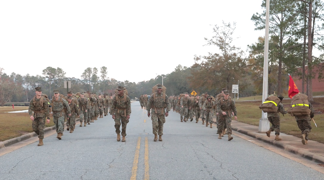Marines with Marine Corps Logistics Base Albany commemorated the 77th anniversary of the attack of Pearl Harbor with a 3-mile Warrior Hike aboard the installation, Dec. 7. The attack was a surprise military strike by the Imperial Japanese Navy Air Service against the United States naval base at Pearl Harbor, Hawaii Territory, on the morning of Dec. 7, 1941. More than 50 Marines took the hike to remember the lessons learned from the attack and why it's important to always train and be ready for the unknown. (U.S. Marine Corps photo by Re-Essa Buckels)