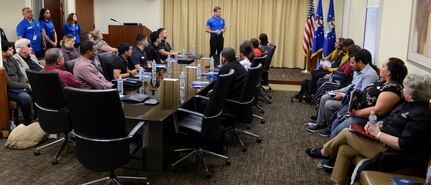 Ed Bujan, Premier College Intern Program recruiting manager briefs Texas A&M University-San Antonio students at Joint Base San Antonio-Randolph Nov. 30. During their tour, the students visited different sections of AFPC where they learned about human resources specializations such as benefits and entitlements, classification and staffing.