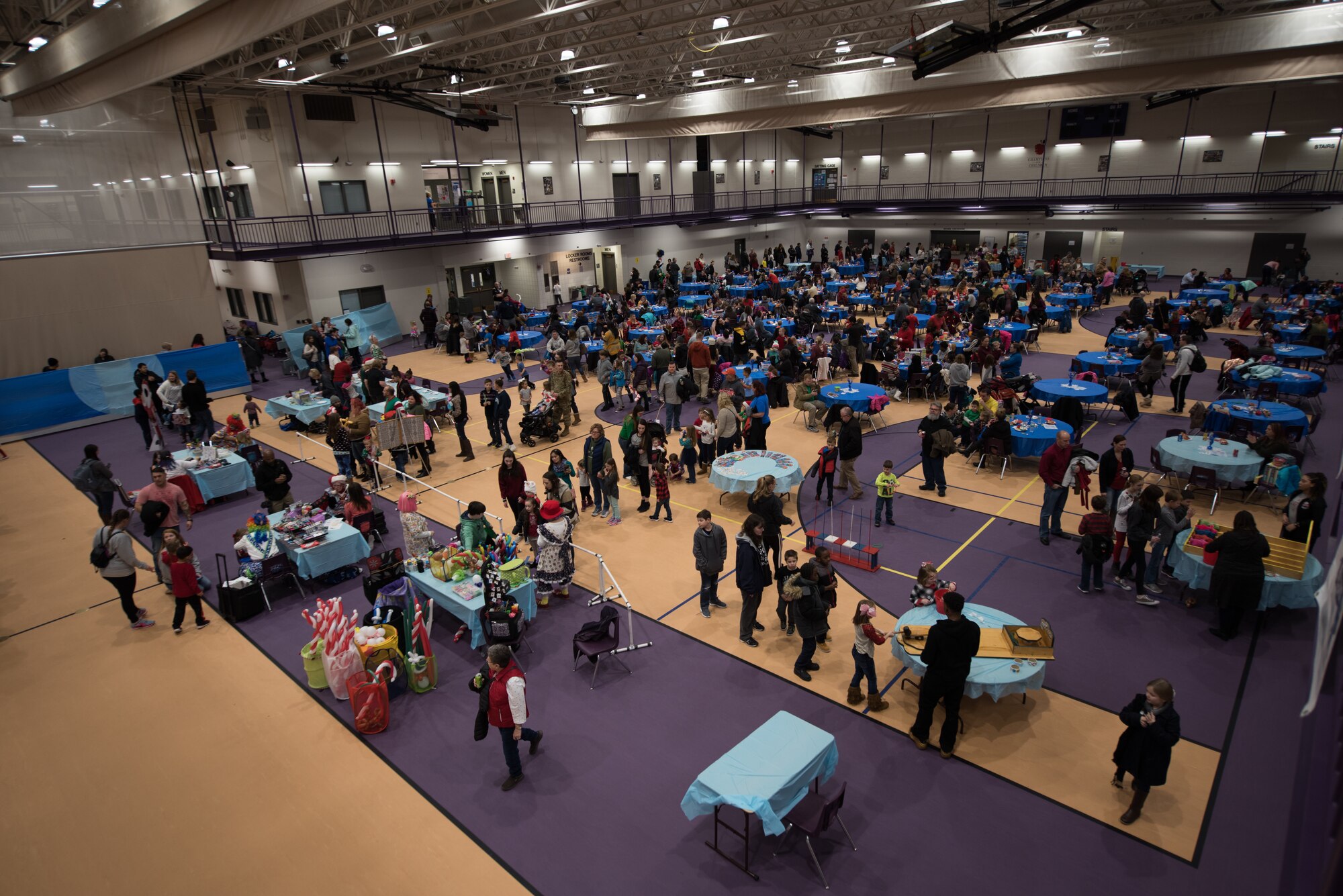Enlisted service members of Offutt Air Force Base attend the 25th Annual Winter Wonderland Dec. 7, 2018, at the Lied Activity Center in Bellevue, Nebraska. A team of more than 60 volunteers enabled the event to run smoothly for approximately 800 attendees. (U.S. Air Force photo by Senior Airman Jacob Skovo)