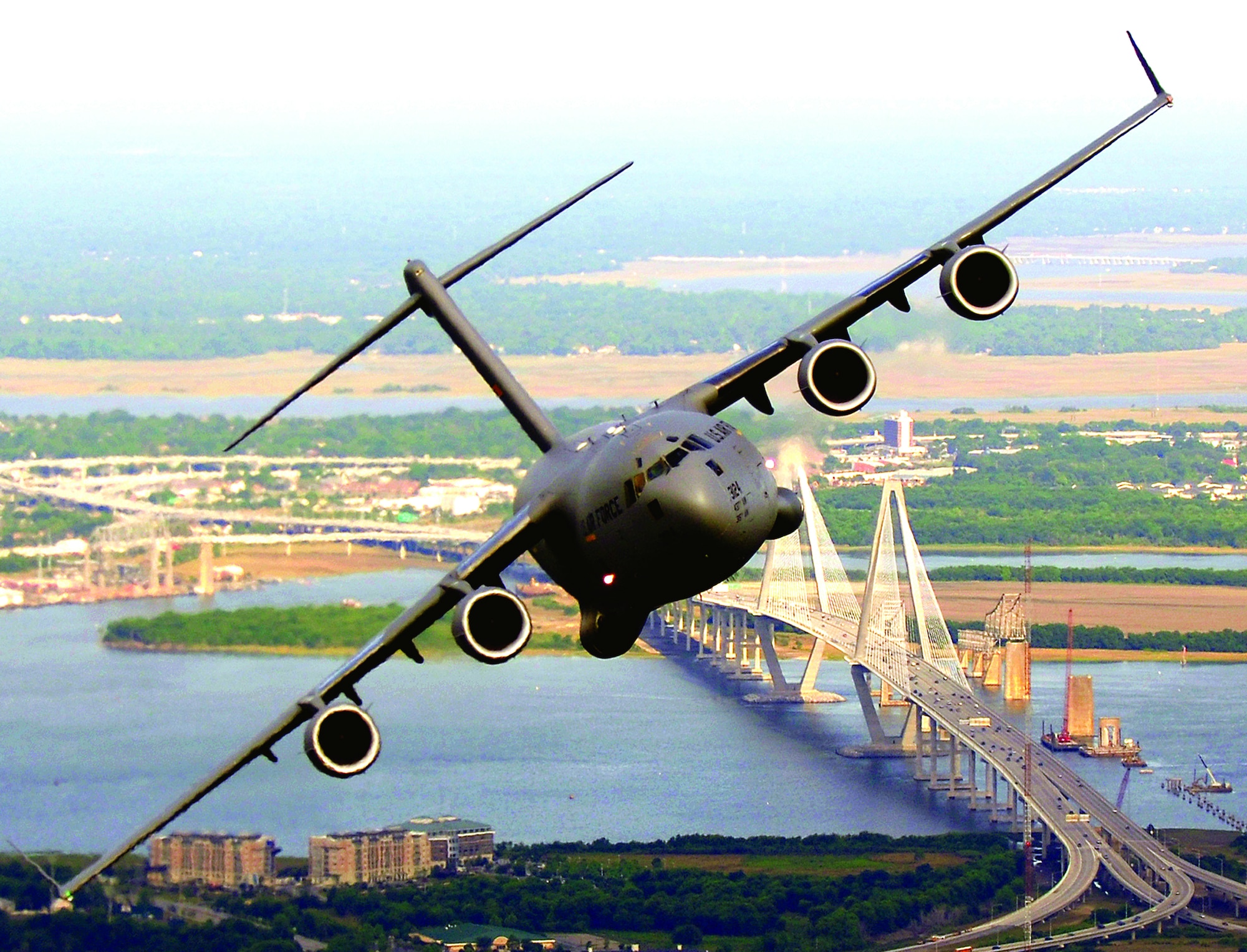 A C-17 Globemaster III from the 14th Airlift Squadron, Charleston Air Force Base, S.C., banks over the Arthur J. Ravenel Bridge in Charleston, S.C., during a training mission May 16, 2006. (U.S. Air Force photo/Tech. Sgt. Russell E. Cooley IV)