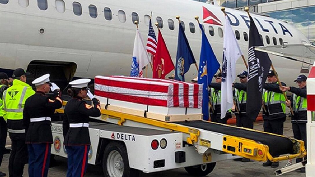 During a layover in Atlanta, Georgia, plane-side honors were delivered during the dignified transfer