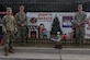 U.S Army Soldiers assigned to the 210th Aviation Regiment, 2nd Battalion, 128th Avn. Brigade stand in front of their winning holiday card at Joint Base Langley-Eustis, Virginia, Dec. 13, 2018. The winning units received gift cards that can be used towards morale events. (U.S. Air Force photo by Senior Airman Derek Seifert)