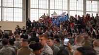 First Lady Melania Trump visited 700 service members, DoD civilians, family members and students at Joint Base Langley-Eustis, Va., Dec. 12, 2018. "Welcome home," and thank you for answering the call of duty to the military members in the audience, said Trump. After addressing the crowd, she took time to shake their hands and pose for photographs in an aircraft hangar at the 1st Fighter Wing. (Courtesy photo by David Phillips/ Released)