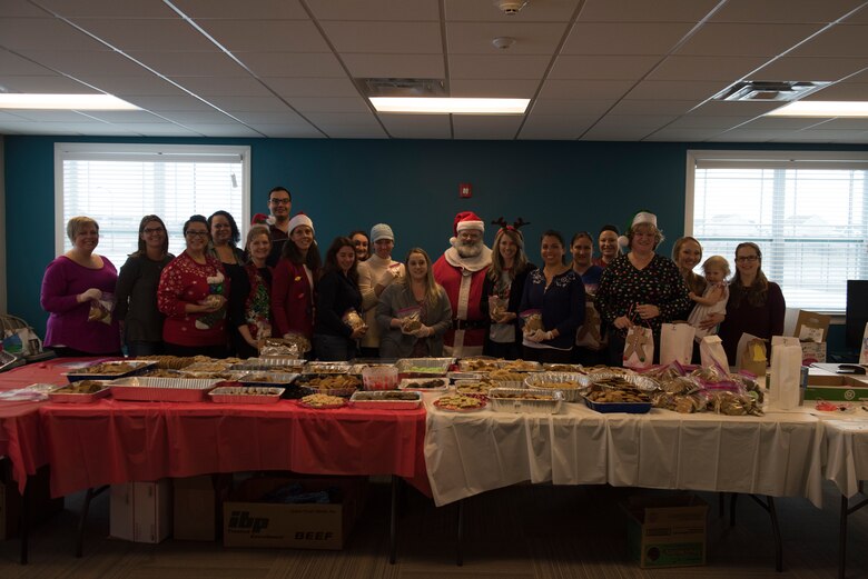 Gunfighter spouses bag cookies for Airmen living in the dorms during the holiday season December 10, 2018, at Mountain Home Air Force Base, Idaho. The cookies give Airmen a taste of home away from home. (U.S. Air Force photo by Airman Nicholas Swift)