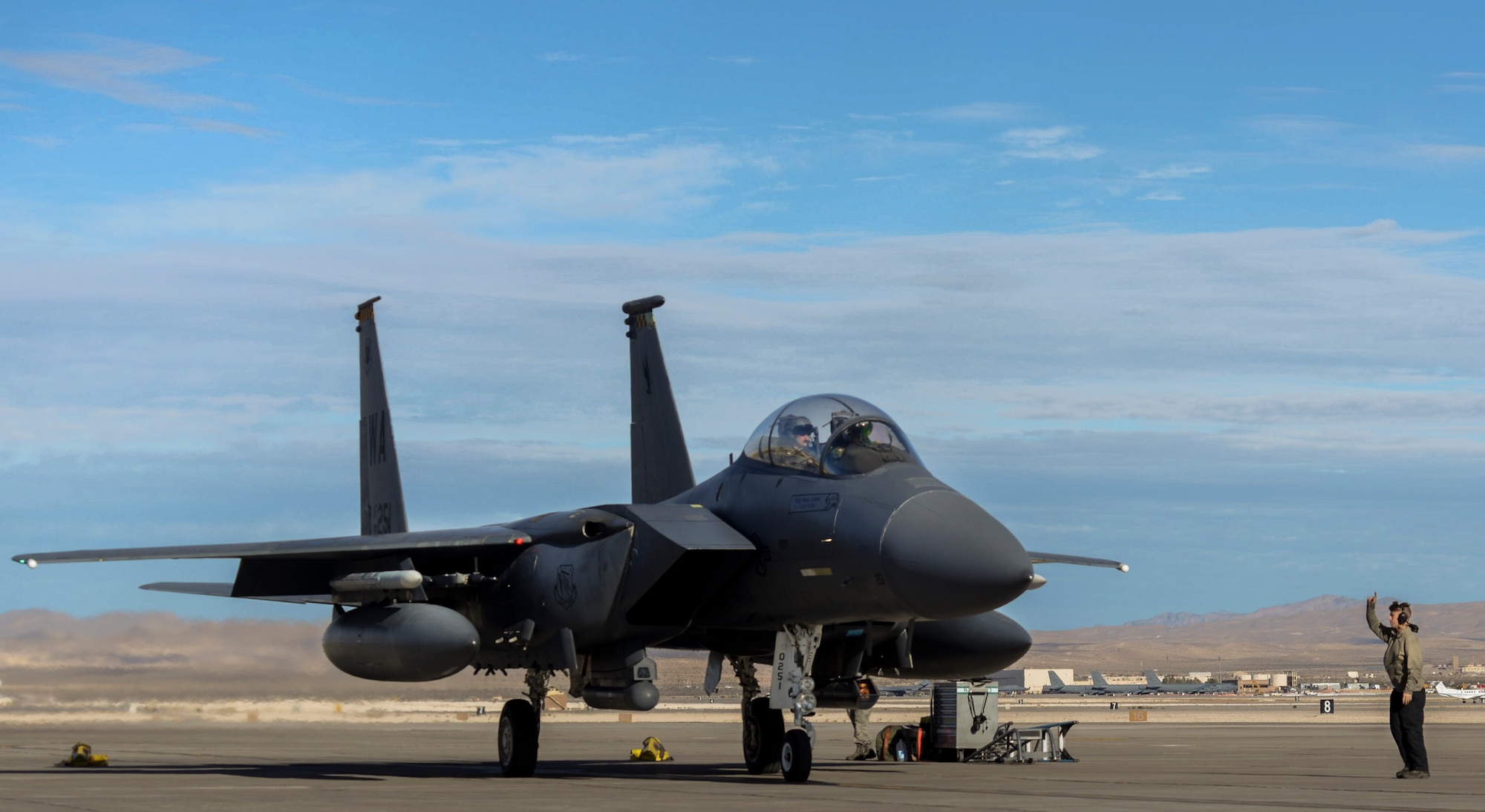 Airman 1st Class Clayton Ackerman, 757th Aircraft Maintenance Squadron Strike Aircraft Maintenance Unit F-15E Strike Eagle fighter jet maintainer, launches an F-15E during the Weapons School Integration (WSINT) Dec. 4, 2018 at Nellis Air Force Base, Nevada. Completing WSINT requires a working relationship with aircraft maintainers, whose roles in the exercise are vital. (U.S. Air Force photo by Airman 1st Class Bailee A. Darbasie)