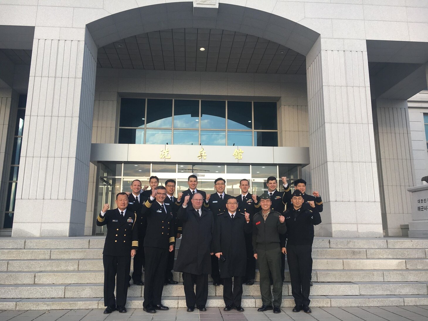 Rear Adm. Jimmy Pitts, Commander, Submarine Group 7, center, and Rear Adm. Jung Il Shik, Commander, Republic of Korea (ROK) Navy Submarine Force pose with a bilateral delegation during the biannual Submarine Warfare Committee Meeting with the ROK Navy Submarine Force.