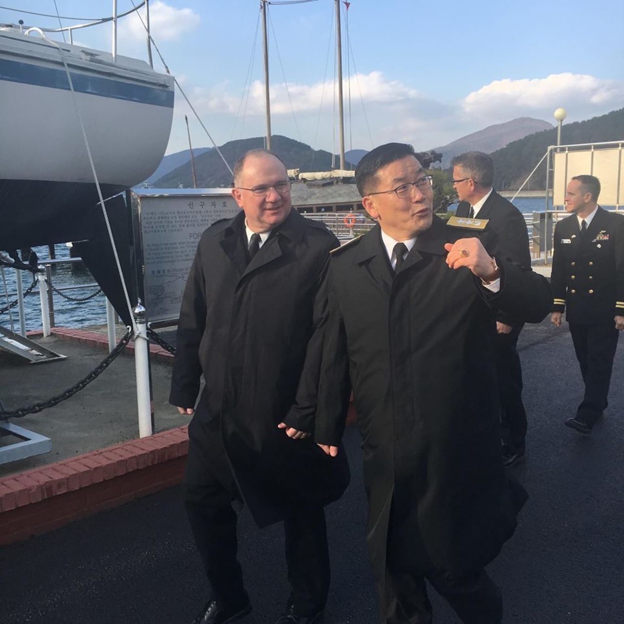 Rear Adm. Jimmy Pitts, Commander, Submarine Group 7, center, and Rear Adm. Jung Il Shik, Commander, Republic of Korea (ROK) Navy Submarine Force pose with a bilateral delegation during the biannual Submarine Warfare Committee Meeting with the ROK Navy Submarine Force.