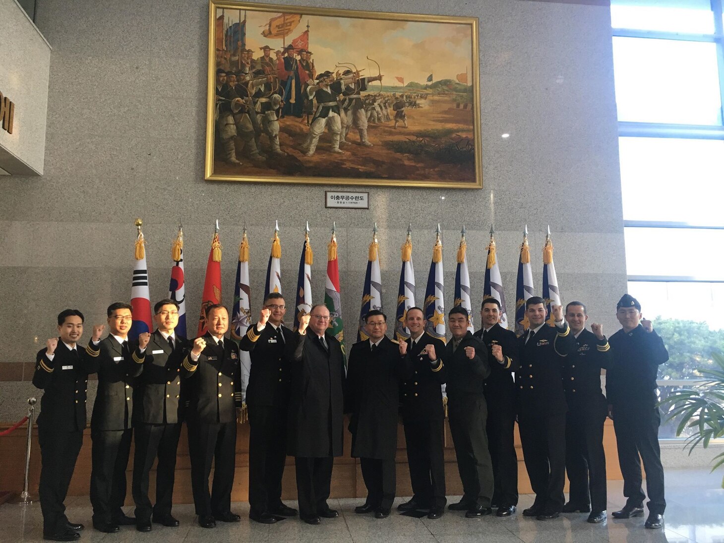 Rear Adm. Jimmy Pitts, Commander, Submarine Group 7, center, and Rear Adm. Jung Il Shik, Commander, Republic of Korea (ROK) Navy Submarine Force pose with a bilateral delegation during the biannual Submarine Warfare Committee Meeting with the ROK Navy Submarine Force.