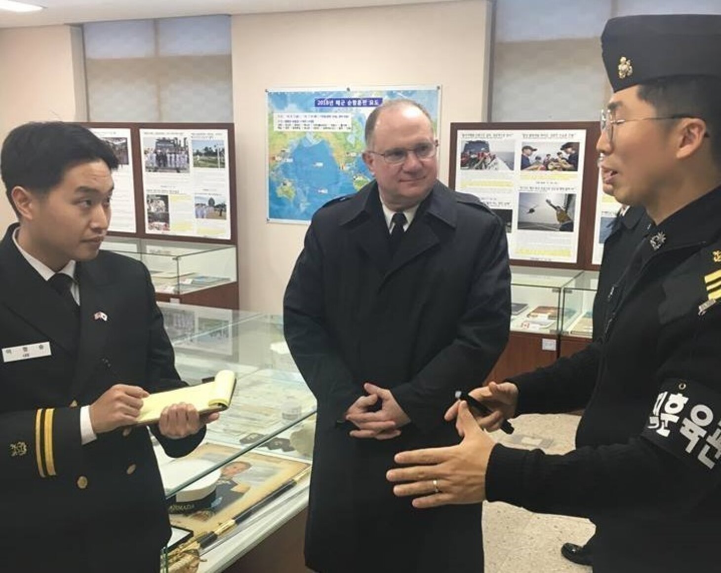 Rear Adm. Jimmy Pitts, Commander, Submarine Group 7, center, and Rear Adm. Jung Il Shik, Commander, Republic of Korea (ROK) Navy Submarine Force pose with a bilateral delegation during the biannual Submarine Warfare Committee Meeting with the ROK Navy Submarine Force.