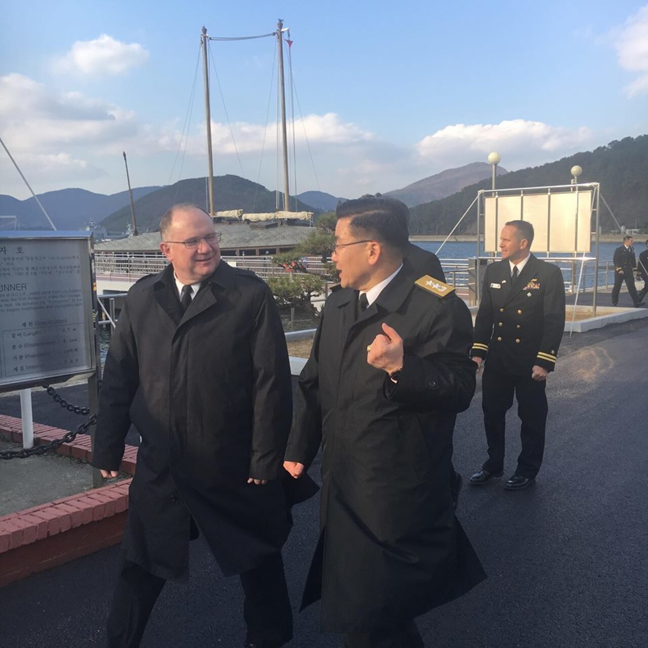 Rear Adm. Jimmy Pitts, Commander, Submarine Group 7, center, and Rear Adm. Jung Il Shik, Commander, Republic of Korea (ROK) Navy Submarine Force pose with a bilateral delegation during the biannual Submarine Warfare Committee Meeting with the ROK Navy Submarine Force.