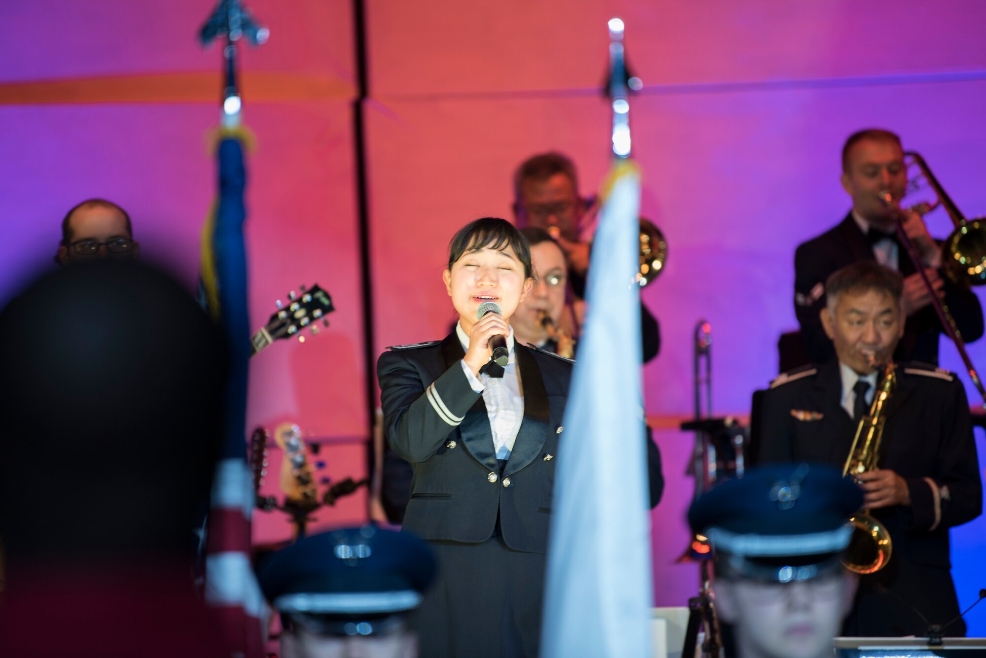Japan Air Self Defense Force Airman 2nd Class Saki Morita, JASDF Central Band vocalist, sings during Sounds of the Season, Dec. 12, 2018, at Yokota Air Base, Japan.