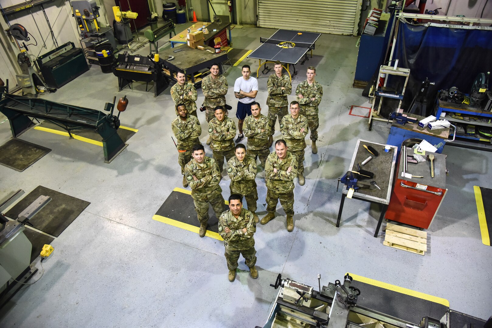 The 380th Expeditionary Maintenance Squadron fabrication flight poses for a group photo at Al Dhafra Air Base, United Arab Emirates, Dec. 10, 2018. The fabrication flight, also known as “Fab Flight” or the “American chopper of aircraft maintenance” is comprised of Sheet Metals, Non-Destructive Inspection and Aircraft Structural Repair technicians. (U.S. Air Force photo by Senior Airman Mya M. Crosby)