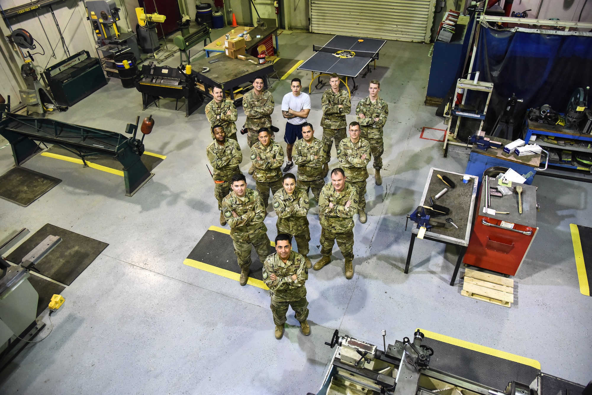 The 380th Expeditionary Maintenance Squadron fabrication flight poses for a group photo at Al Dhafra Air Base, United Arab Emirates, Dec. 10, 2018. The fabrication flight, also known as “Fab Flight” or the “American chopper of aircraft maintenance” is comprised of Sheet Metals, Non-Destructive Inspection and Aircraft Structural Repair technicians. (U.S. Air Force photo by Senior Airman Mya M. Crosby)