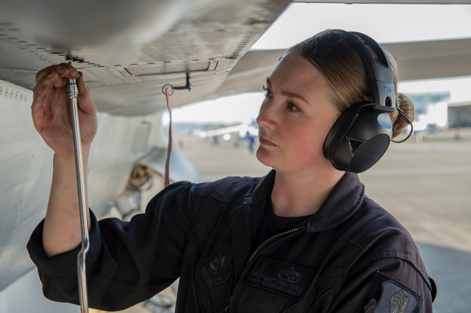 Fixing a panel on an F-16 Fighting Falcon