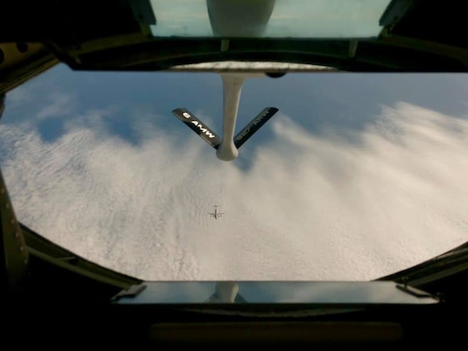 A KC-135 Stratotanker disconnects from a C-17 Globemaster III