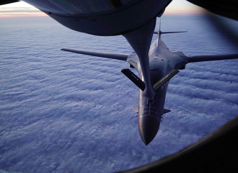 An aerial refueling of a B-1B Lancer by a KC-135