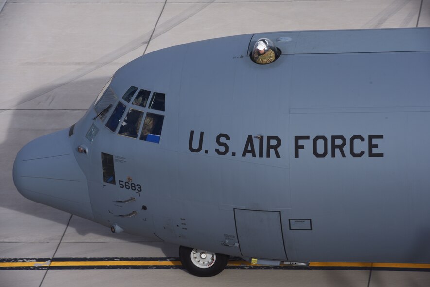 A C-130 Hercules aircrew ready the aircraft for take off from Creech Air Force Base, Nevada, Dec. 10, 2018, as the base supported a Joint Forcible Entry exercise. The objective of this exercise is to integrate Army airborne and land operations, with joint air support, and special operations against an opposing enemy force. (U.S. Air Force Photo by Senior Airman James Thompson)