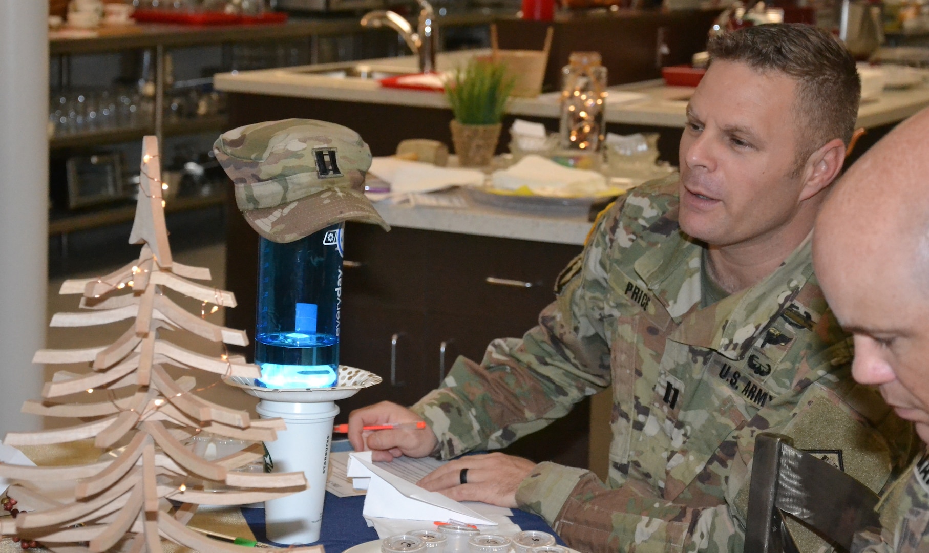 Capt. Aaron Price, 232nd Medical Battalion, Company E, commander, looks at a tower made of different objects during an activity in which servicemembers had to complete as many tasks as possible in five minutes at “The Gift of Presence: Resiliency Reset” event held at the Vogel Resiliency Center located inside Joint Base San Antonio-Fort Sam Houston Nov. 30.