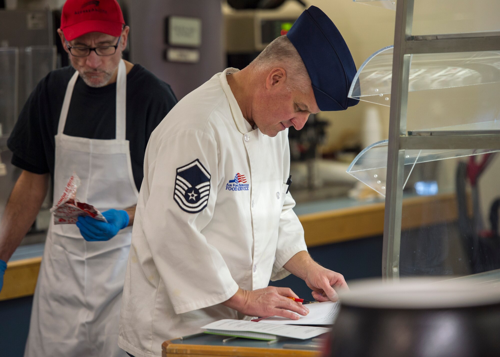 U.S. Air Force Master Sgt. John Giese, 133rd Force Support Squadron, Sustainment Services Flight, checks the quality of the food for the Wing holiday meal at the dining facility in St. Paul, Minn., Nov. 11, 2018.
