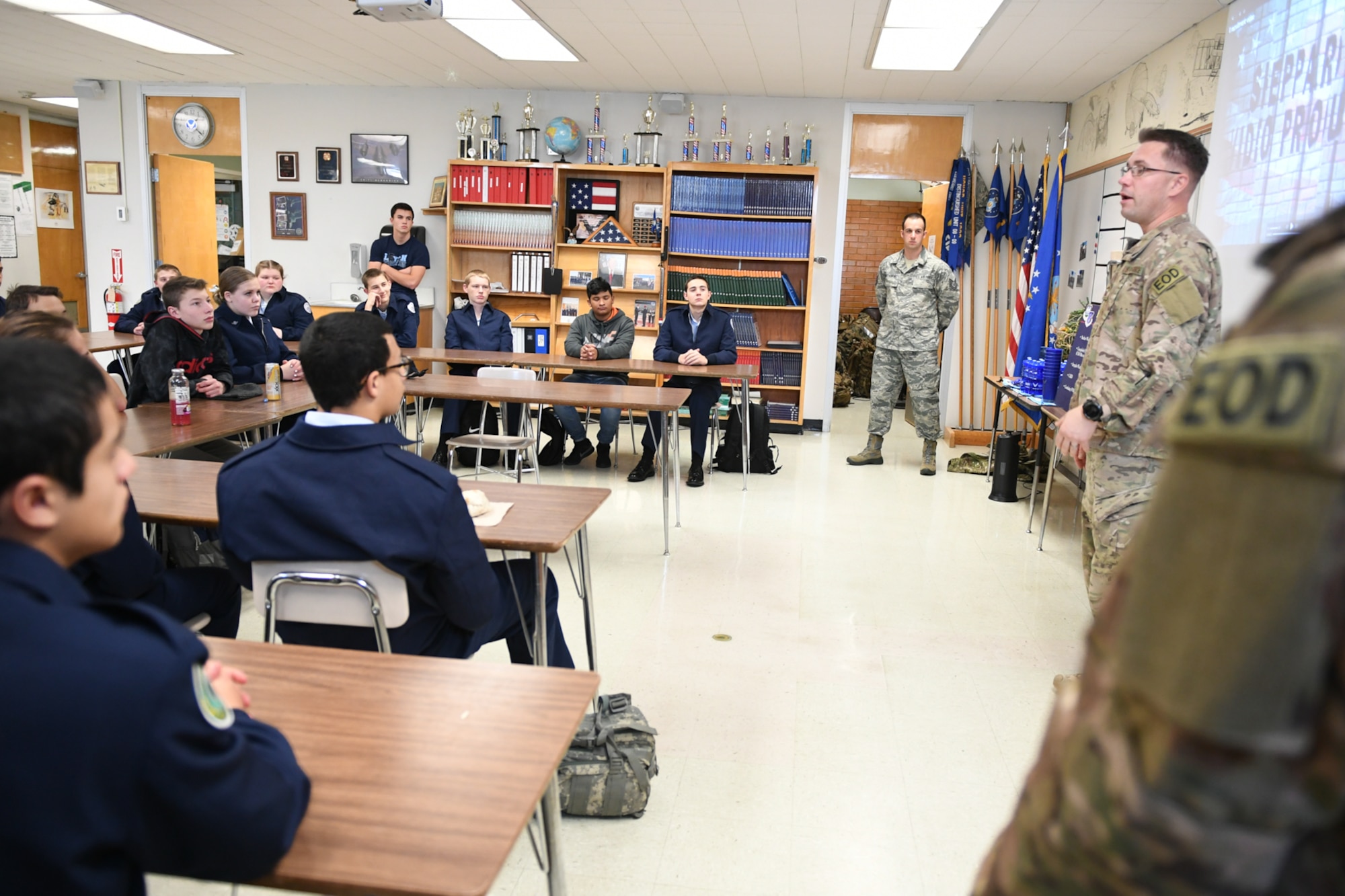 Senior Master Sgt. Eric Eberhard, 419th Explosive Ordnance Disposal Flight, explain the EOD career field in the Air Force. Technical Sgt. Andrew Mistkowski (back), 419th Fighter Wing recruiter, invited Hill Air Force Base EOD technicians to meet with Junior Reserve Officer Training Corps students at Clearfield High School in Clearfield, Utah, Dec. 12, 2018. (U.S. Air Force photo by Cynthia Griggs)