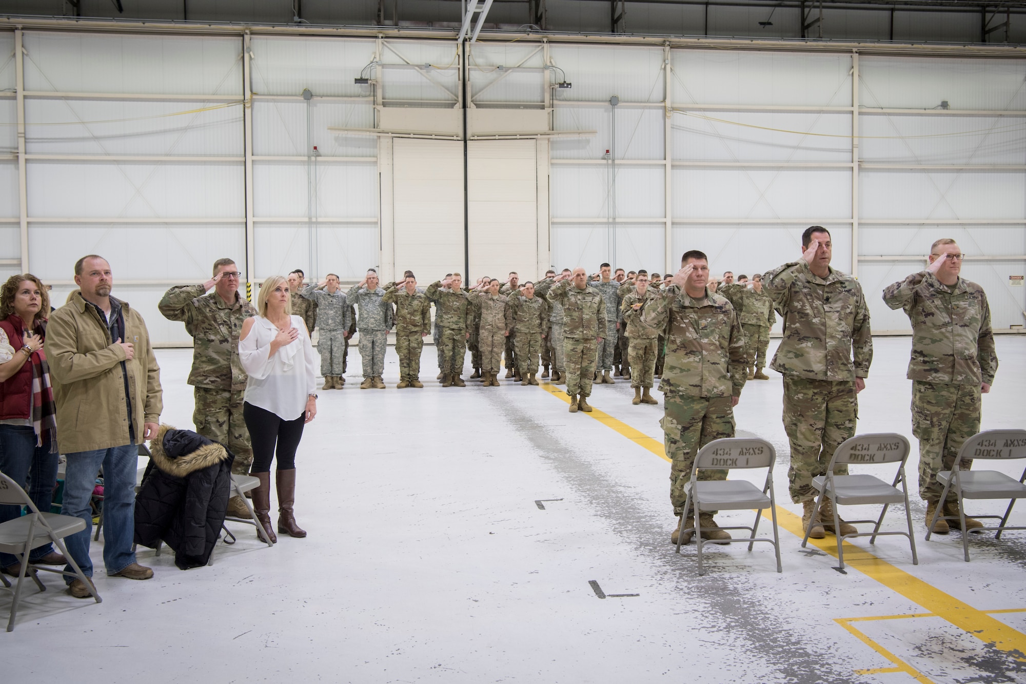 Army Reservists from the 316th Psychological Operations Company stand for the national anthem during a change of command ceremony at Grissom Air Reserve Base, Ind., Nov. 18, 2018. Lich replaced outgoing commander Maj. Glenn Laws who, along with Lich, lead the unit to be the 6th highest performing PSYOP company in the nation. (U.S. Air Force photo / Master Sgt. Ben Mota)