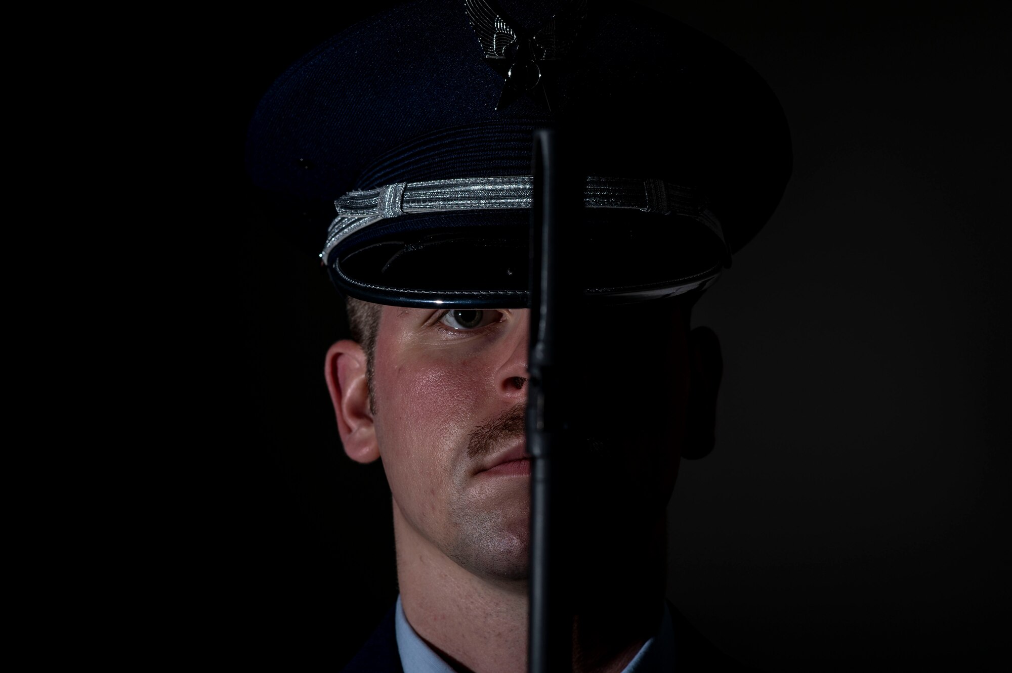 U.S. Air Force Staff Sgt. Justin Hall, 20th Force Support Squadron honor guardsman, presents arms at Shaw Air Force Base, S.C., Dec. 11, 2018.