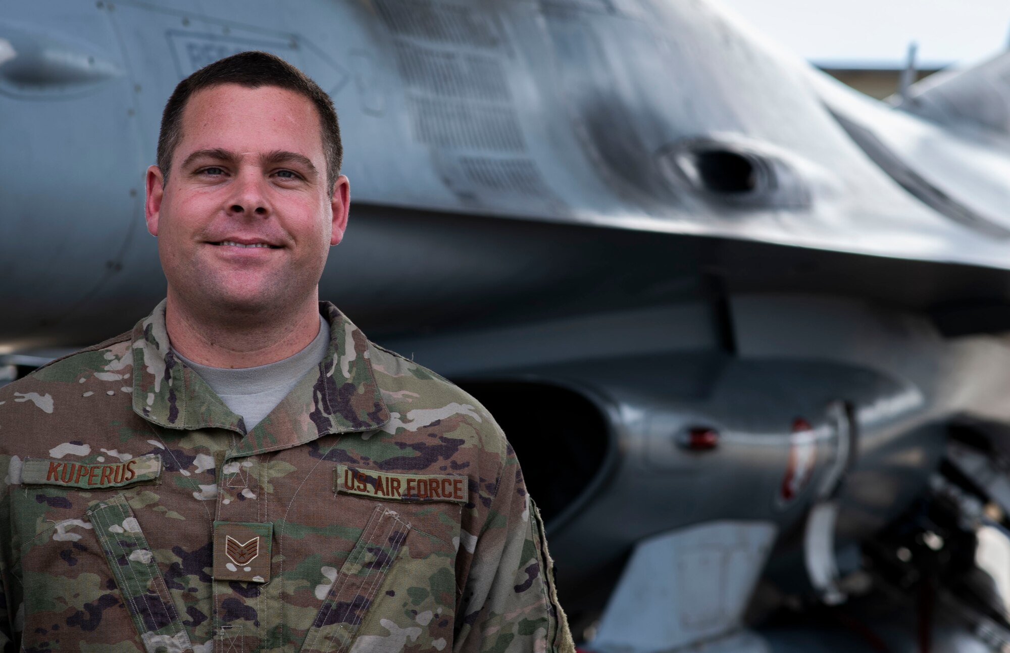 U.S. Air Force Staff Sgt. Matthew Kuperus, 20th Aircraft Maintenance Squadron dedicated crew chief, stands by an F-16CM Fighting Falcon at Shaw Air Force Base, S.C., Dec. 13, 2018.