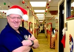 Marc Collette, Headquarters Air Education Training Command, equipment manager, A4R Logistics and Readiness Division, poses with a decorated office as his backdrop, Dec. 4, 2018 at Joint Base San Antonio, Texas. Collette started this tradition after going through a divorce in 1997 to cheer up his children.