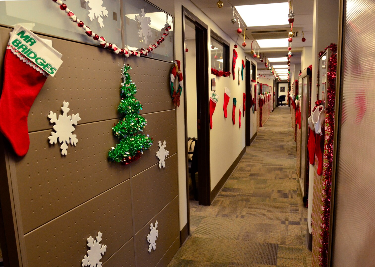 The main walkway of Air Education and Training Command, A4R Logistics and Readiness office is decorated with gift wrapping, stockings and other seasonal ornaments by Marc Collette, Headquarters AETC, command equipment manager, A4R December 4, 2018 at Joint Base San Antonio, Texas. Collette tries not to impose on anyone’s workspace and focuses his creative design on the common areas.