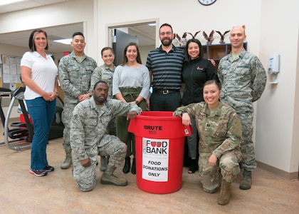 The 359th Medical Operations Squadron Physical Therapy Flight is leading the 359th Medical Group at Joint Base San Antonio-Randolph in food drives to assist the San Antonio Food Bank and the victims of Hurricane Michael. Helping out with the food drive on Dec. 10, 2018, are, front row from left, Staff Sgt. Gregory Jones, physical therapy technician, and Capt. Stephanie Chayrez, flight commander; and, back row from left, Jocelyn Lombard, physical therapist assistant; Airman 1st Class Albert Lapera, physical therapy technician; Senior Airman Monica Hoerner, family health technician; Carolyn Chavana, physical therapy intern from University of the Incarnate Word; Dr. Jason Wheeler, staff physical therapist; Jessica Bolin, Promotion Physical Therapy physician liaison; and Lt. Spencer Carrier, intern from Army-Baylor University Doctoral Program in physical therapy. The flight is partnering with Promotion Physical Therapy in San Antonio on the drive to benefit the San Antonio Food Bank.