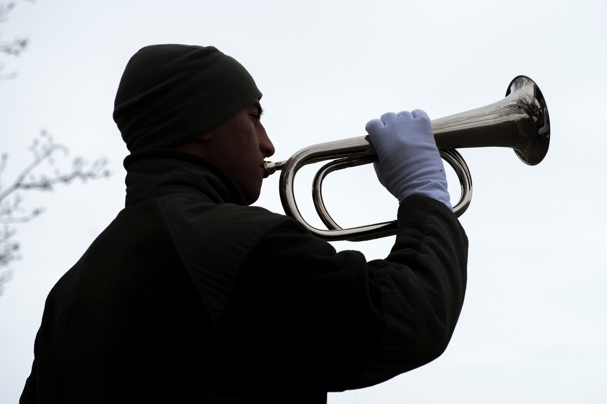 Senior Airman Naseem Eissa, 366th Fighter Wing base ceremonial guardsman, plays taps during funeral sequence training Dec. 7, 2018, at Mountain Home Air Force Base, Idaho. The U.S. Air Force Honor Guard held a ceremonial guardsman training course Dec. 3-12 to help the base honor guard maintain their skills during multiple member sequence training. (U.S. Air Force photo by Airman 1st Class JaNae Capuno)