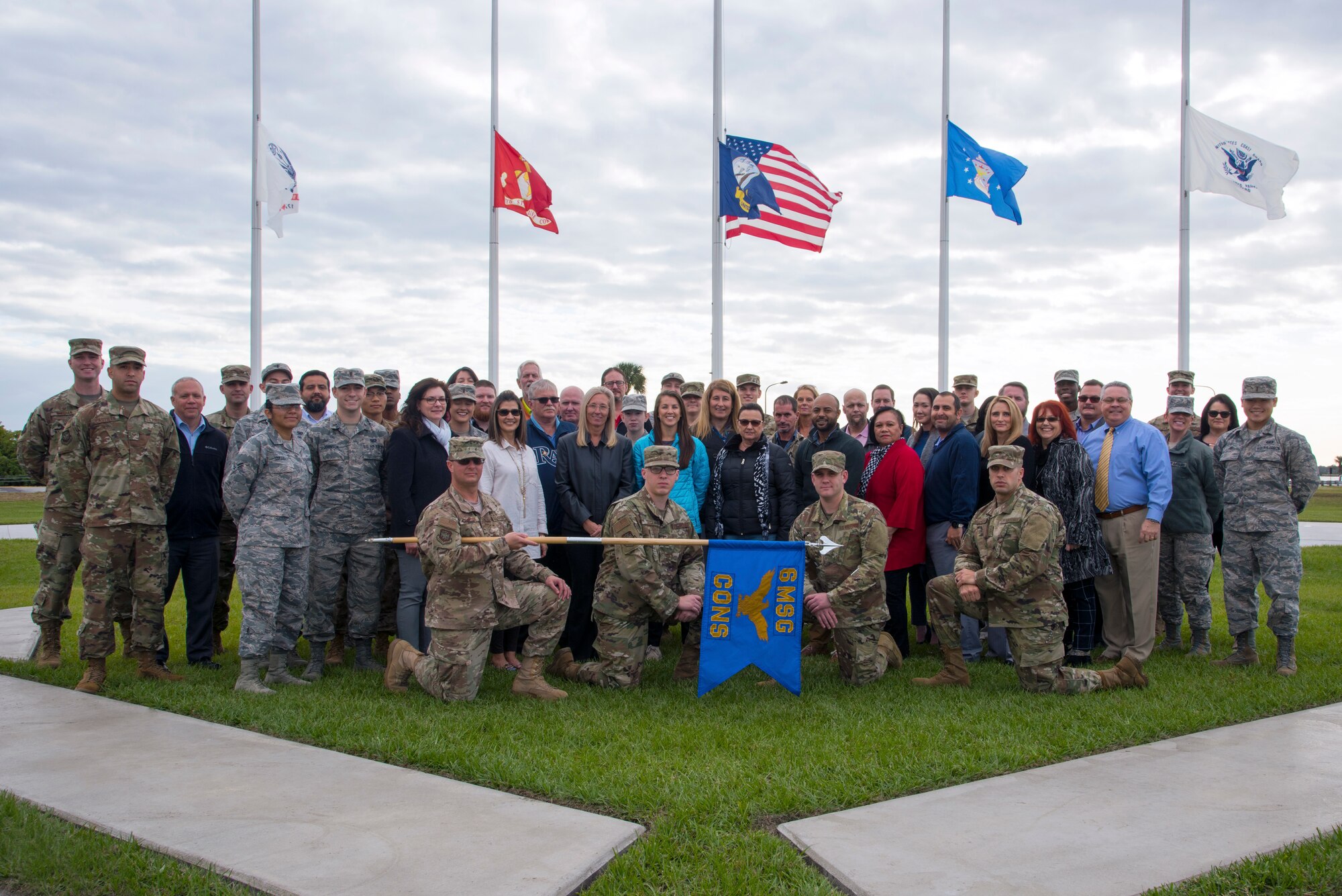 The 6th Contracting Squadron Airmen and civilian employees pause for a photo at MacDill Air Force Base, Fla., Dec. 11, 2018.