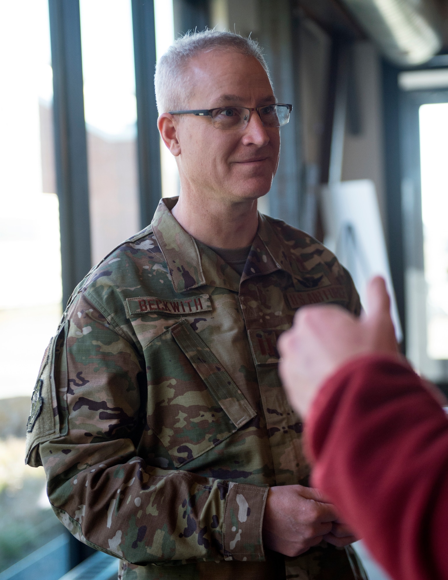U.S. Air Force Chaplain (Capt.) Keith Beckwith, 133rd Chapel Corps, speaks to another service member at a Yellow Ribbon event in St. Paul, Minn., Nov., 11, 2018.